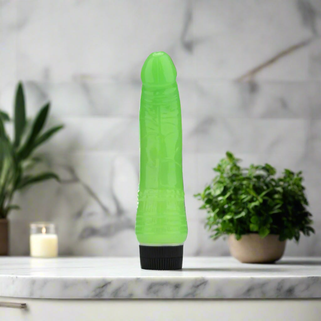 Green and black textured vibrator on a white background