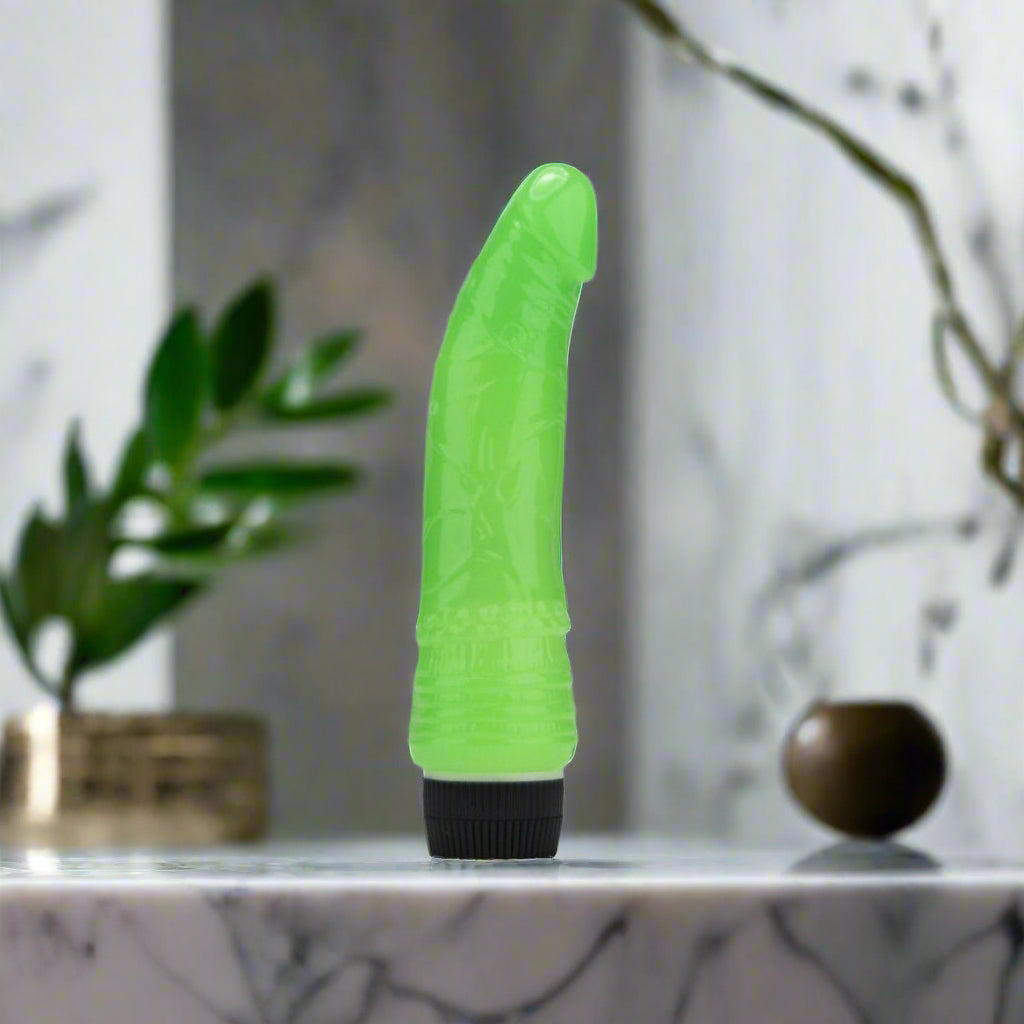 Green and black vibrator on a white background