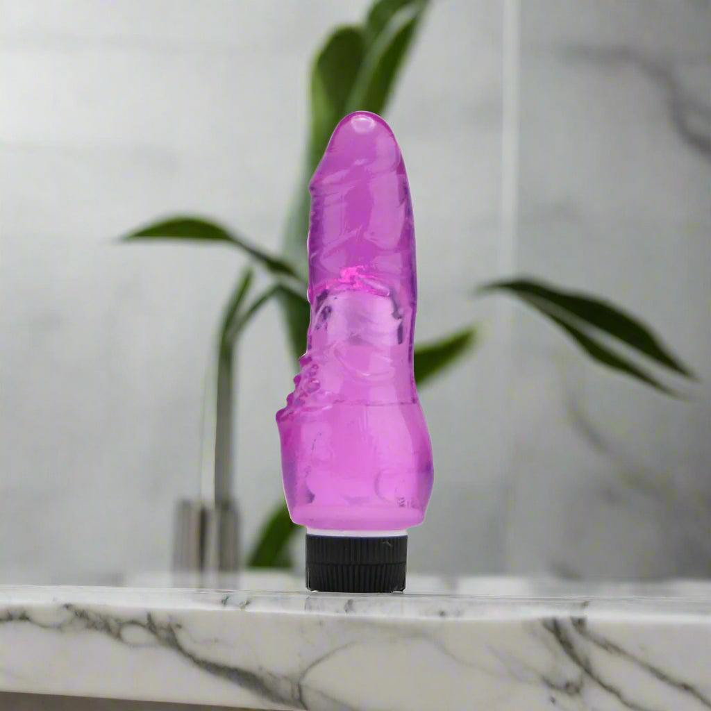 Purple vibrator on a white background