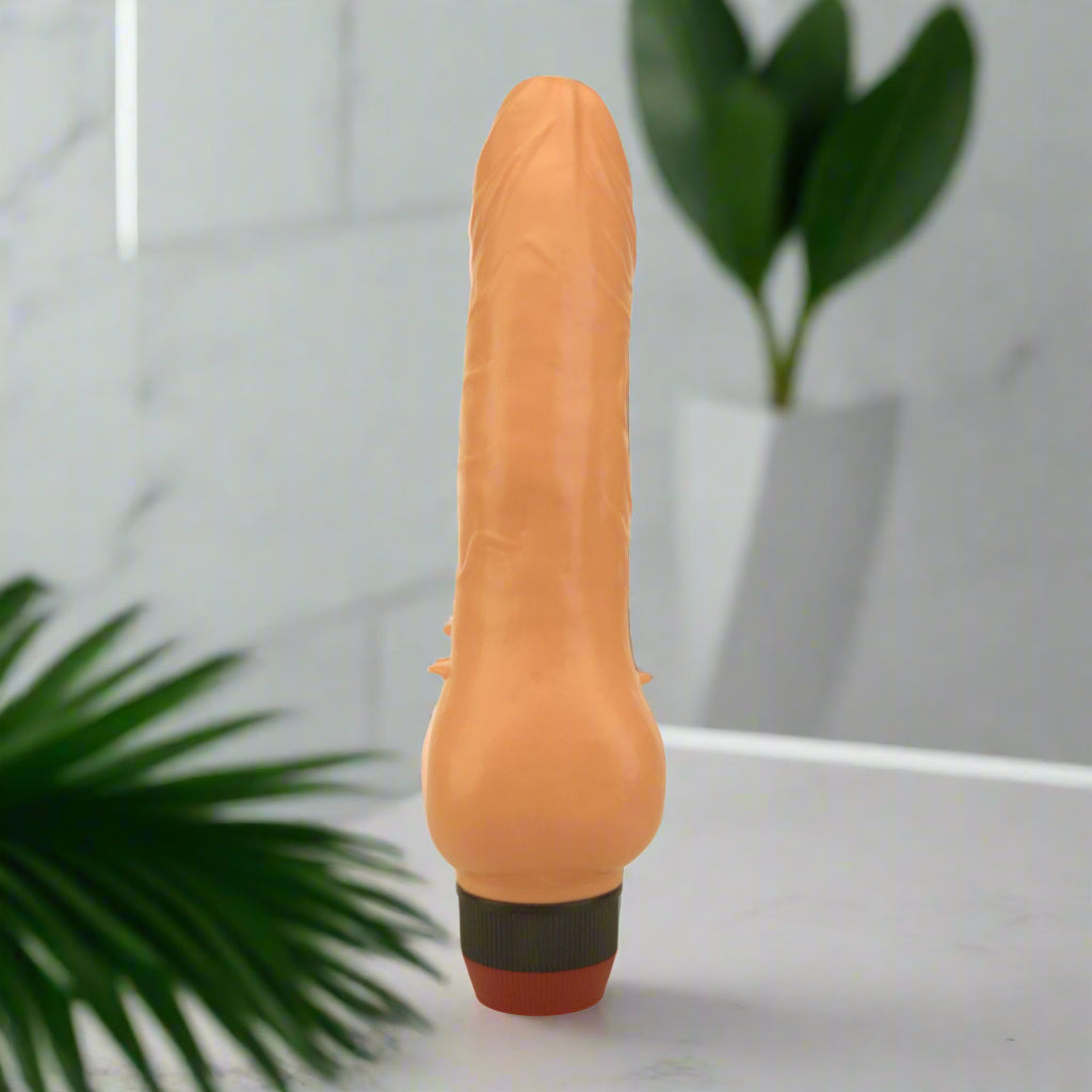 Tan-coloured Vibrator on a white background