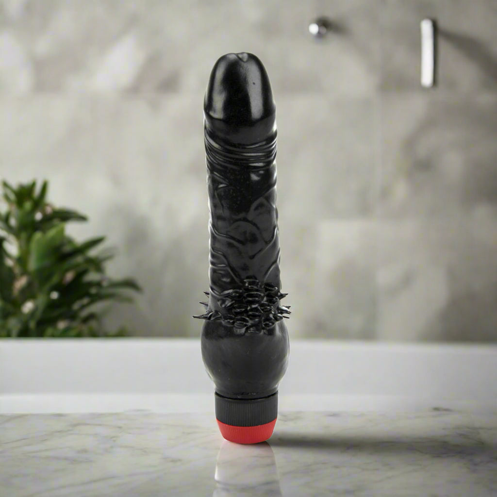 Black Vibrator with textured design on a white background