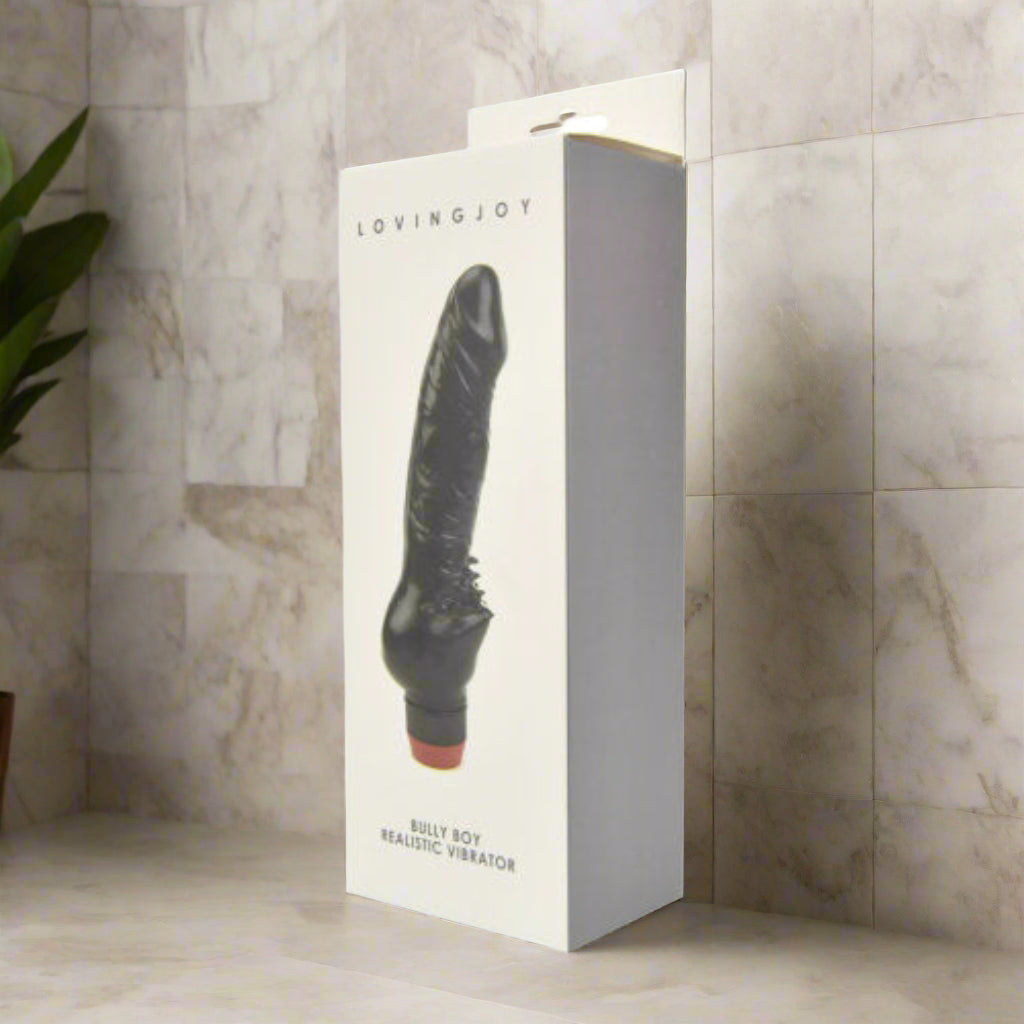Black realistic vibrator in a 'LovingJoy' box on a white background