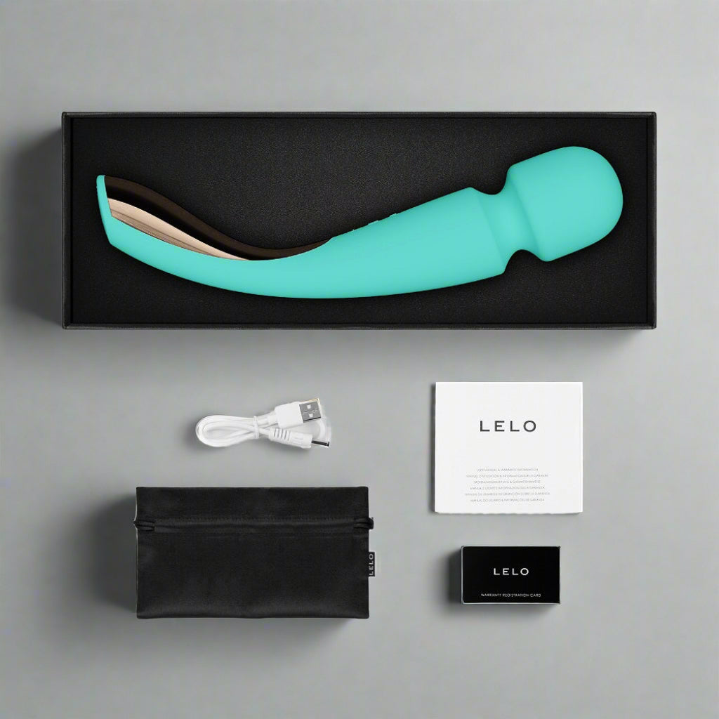 Turquoise electronic device with packaging, USB cable, and user manual on a white background