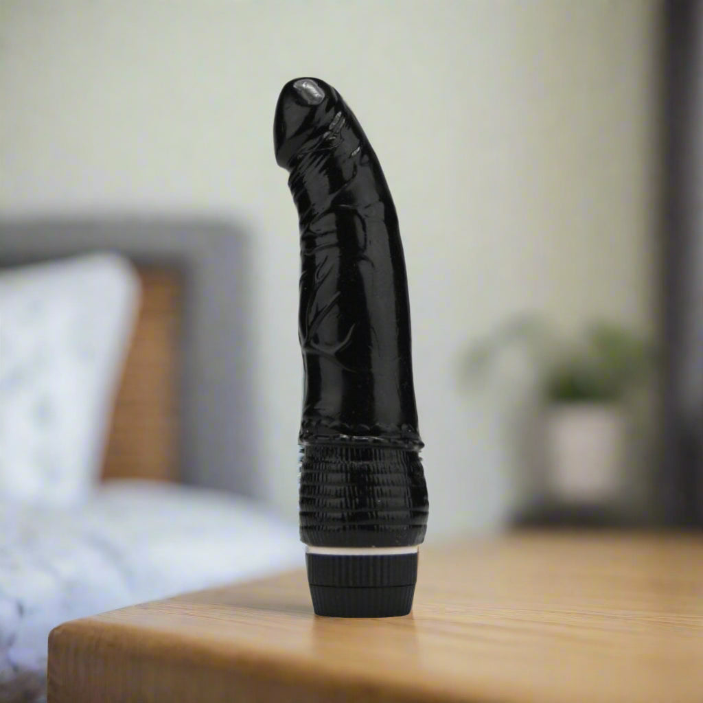 Black vibrator on a white background