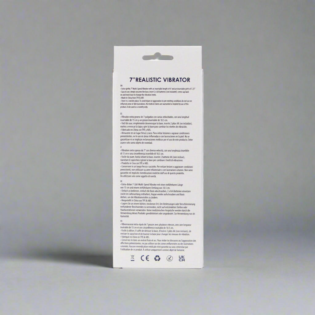 White packaging of a realistic vibrator with text on a white background