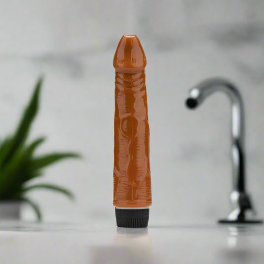 Brown textured vibrator with a black base on a white background
