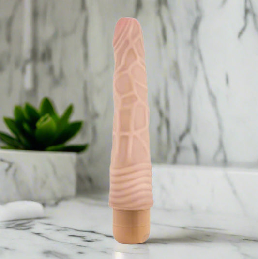 Pink vibrator on a white background