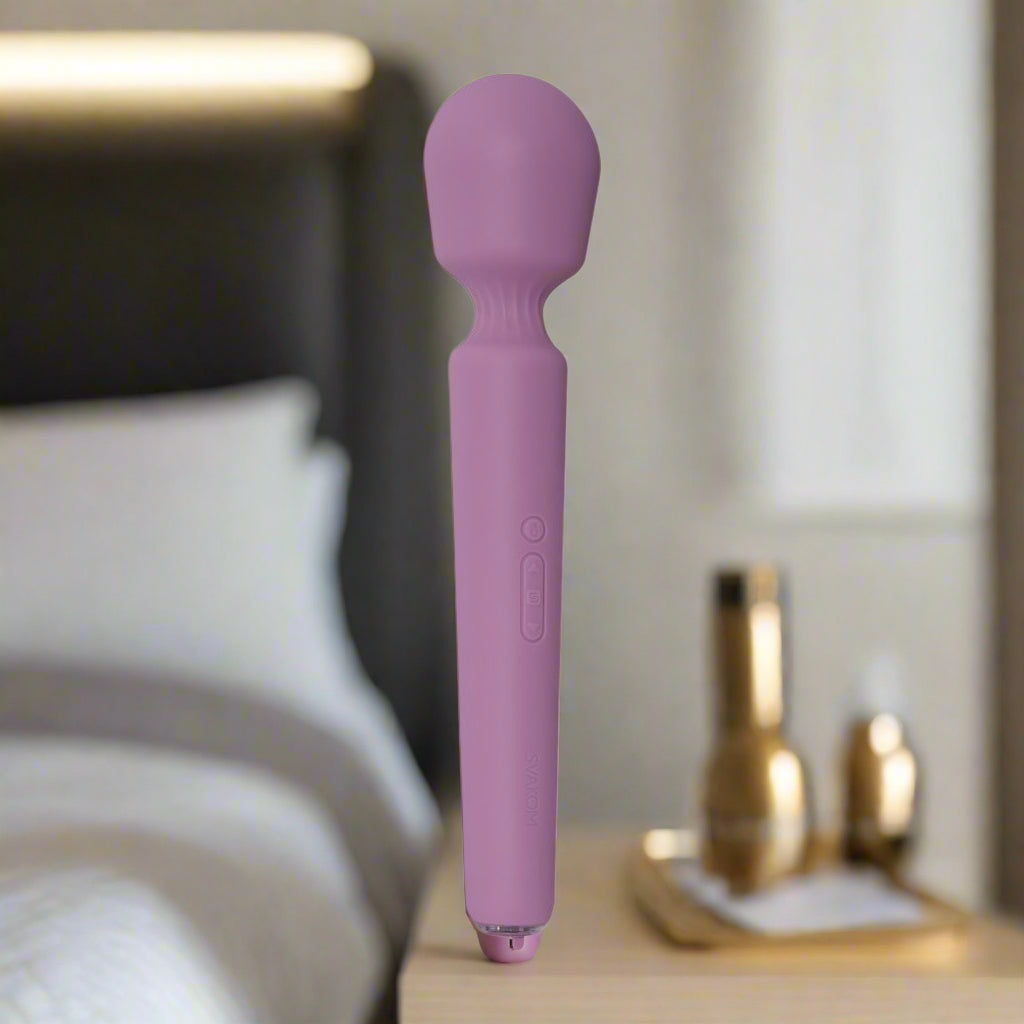 Purple wand vibrator on a white background
