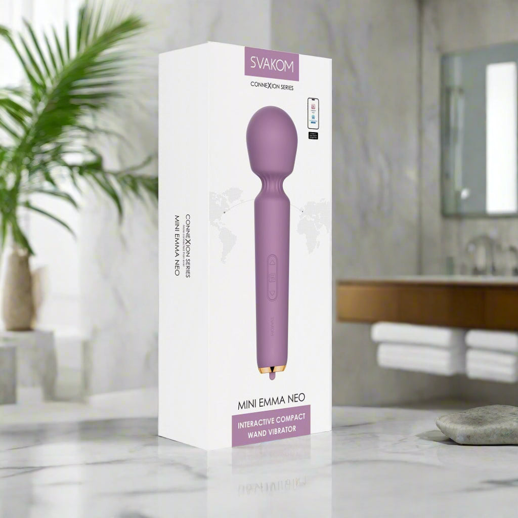 Purple handheld vibrator with packaging on a white background
