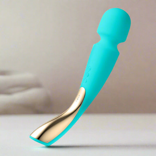 Turquoise and gold wand vibrator on a white background